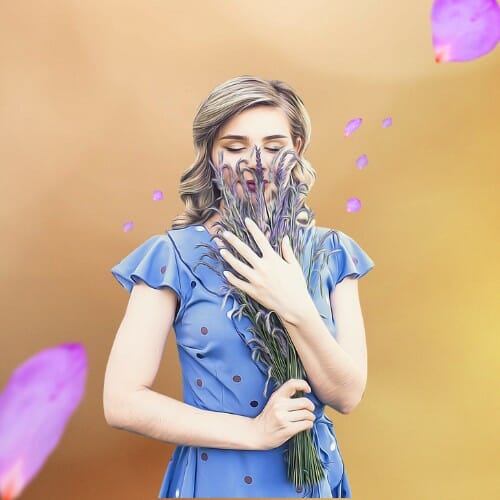 A cute girl in a cartoon blue dress with flowers in her hands.